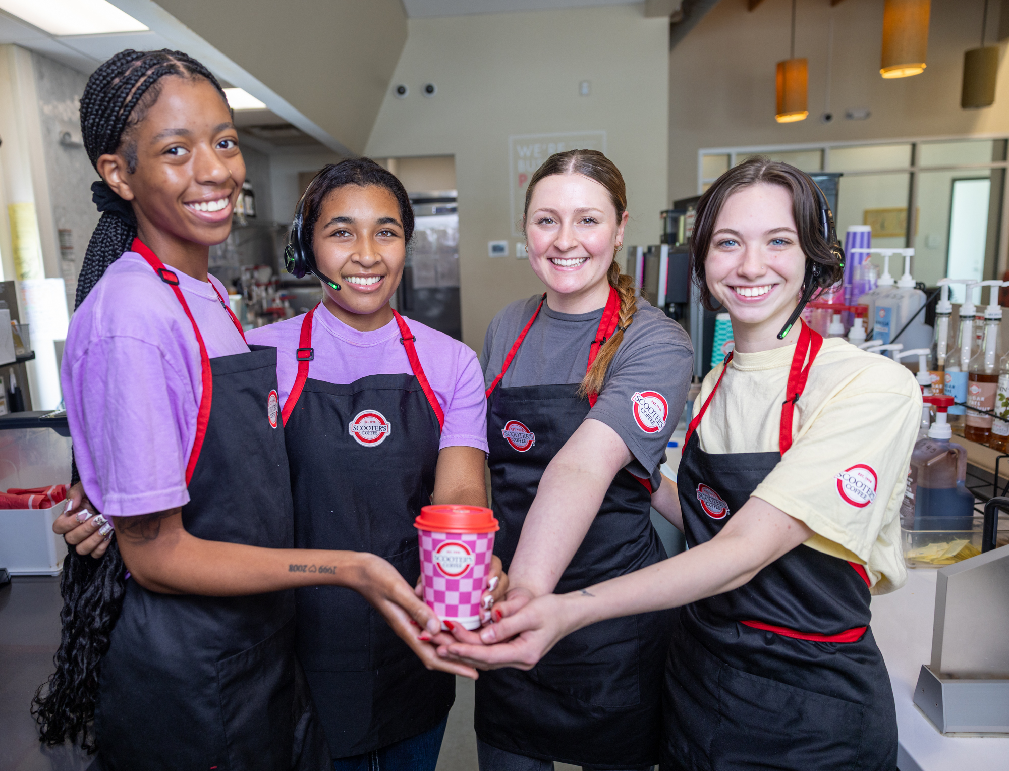 Scooter’s Coffee team inside a coffeehouse